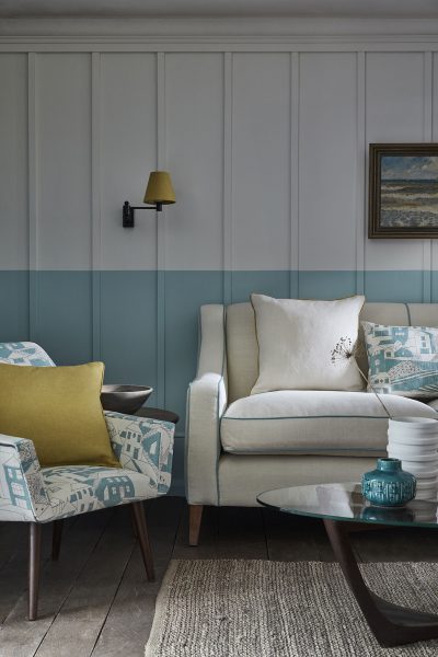 blue and white fabric covered tub chair