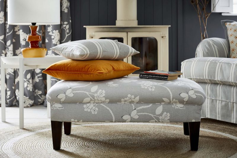 Ashcroft traditional coffee table style footstool in grey flower pattern