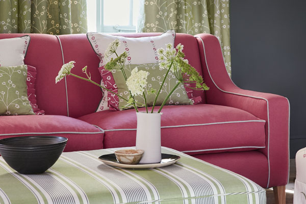 bespoke chedworth sofa covered in pink fabric