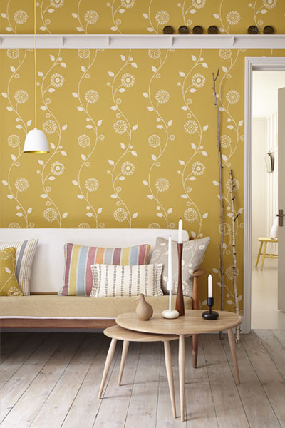 Gypsy Garland - Wall Covering - Saffron on wall behind sofa room setting