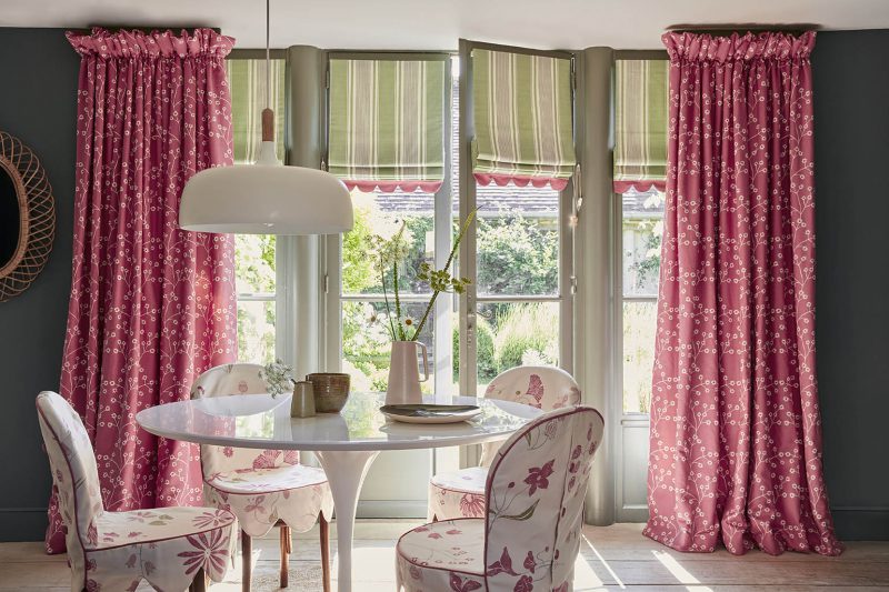 pink curtains in a bright dining room
