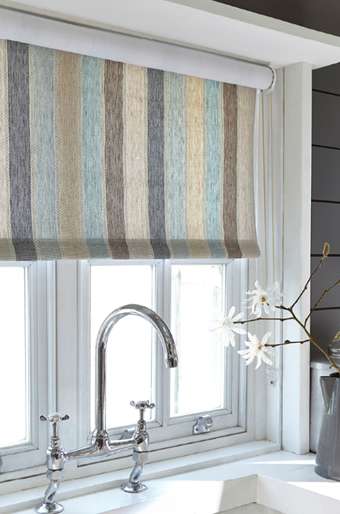 striped roller blind over a sink