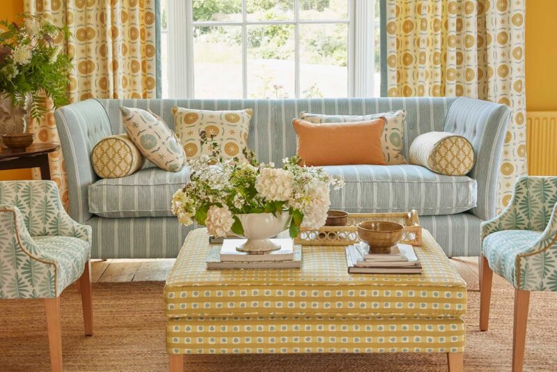 Footstool upholstered in patterned fabric