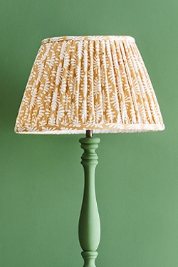 pleated lampshade on a floor lamp